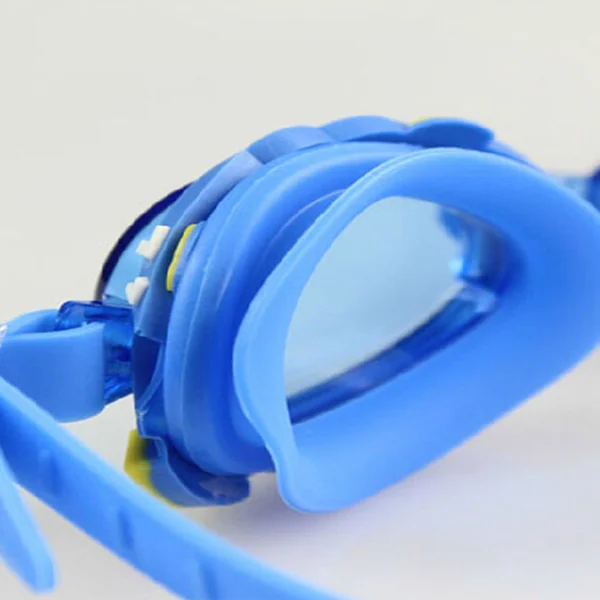 Close-up of blue children's swimming goggles with soft silicone seal and adjustable strap on a plain white background.