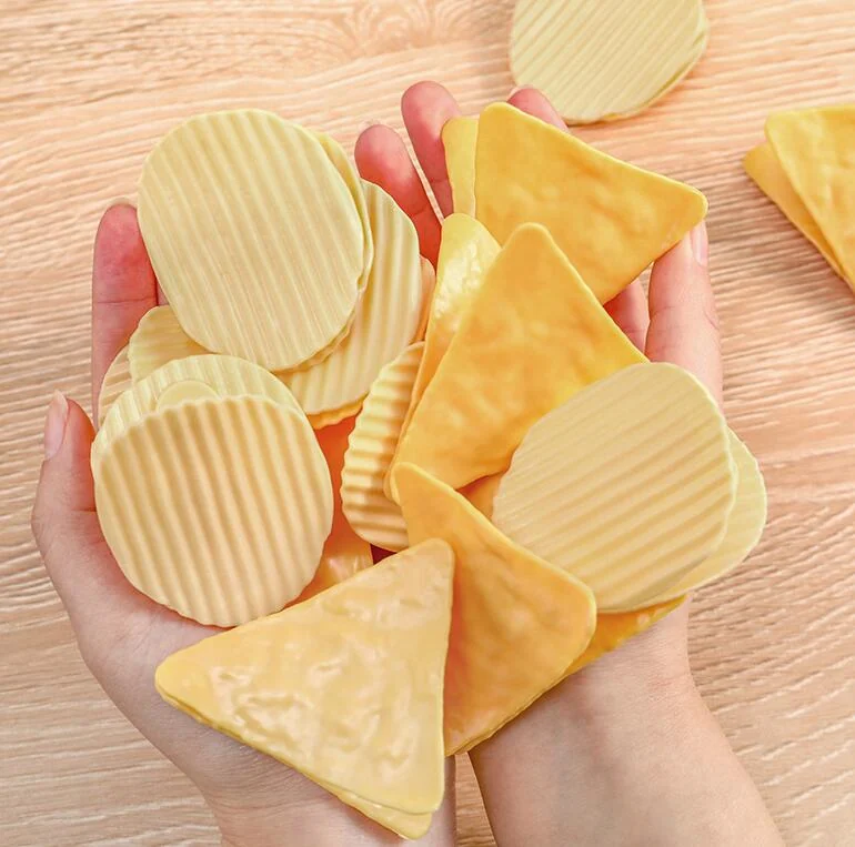 Creative potato chip shape sealing clip standing upright on a table