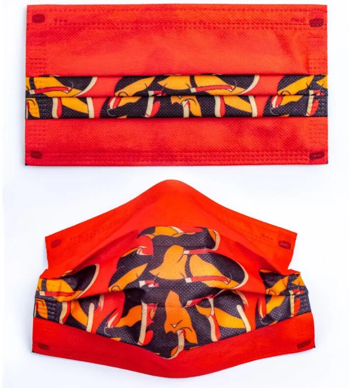 Red disposable 3D face mask with yellow toucan print shown flat and worn-shaped on a white background