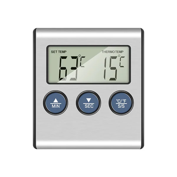 Thermometer placed on a kitchen counter next to a grill and meat