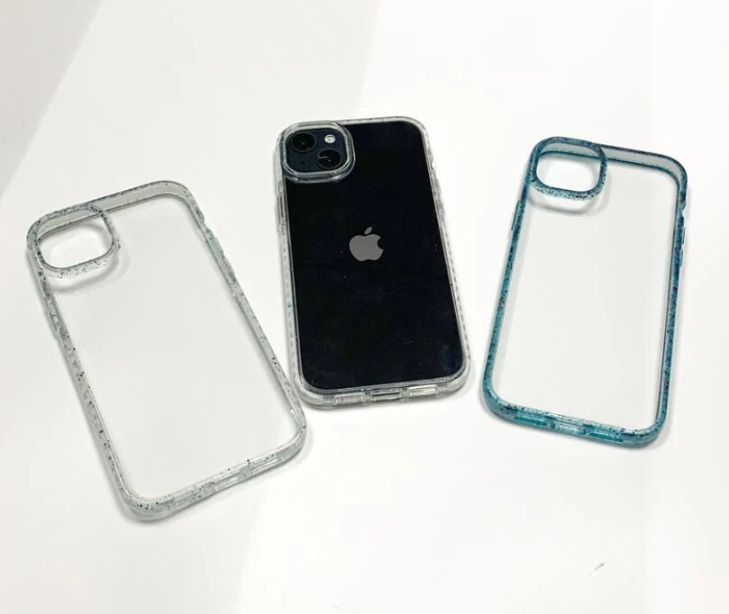 Three clear drop-proof phone cases in silver, clear, and teal glitter finish displayed on a white surface