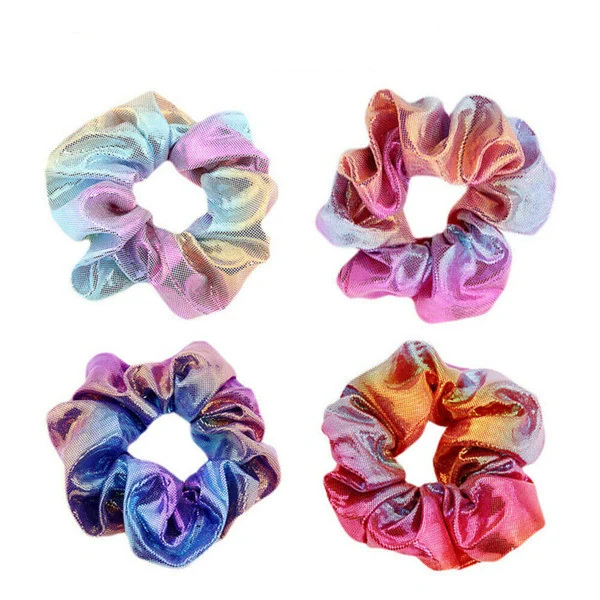 Four shiny holographic hair scrunchies in rainbow metallic colors arranged in a grid on a white background