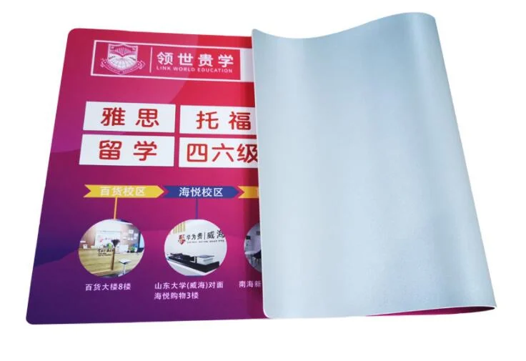 Rolled printed desk pad with Chinese education advertising text and a brand logo, edge curling up, on white background