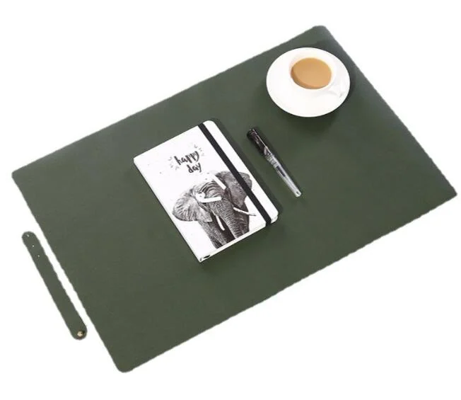 Dark green PU leather desk pad styled with a white coffee cup, pen and elephant notebook on a white background