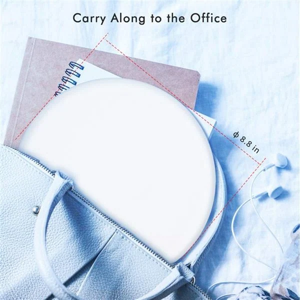 Lamp next to a calendar and notebook in a home office setting