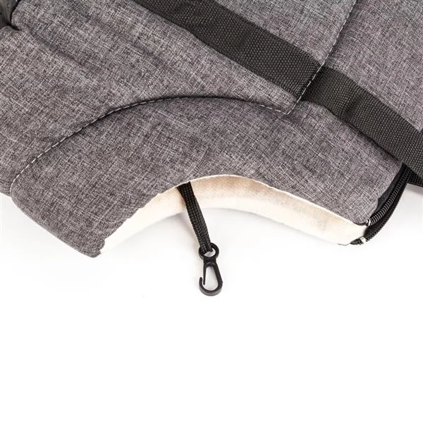 Close-up of a gray pet carrier bag showing quilted fabric, black straps and an inner safety leash clip with fleece lining