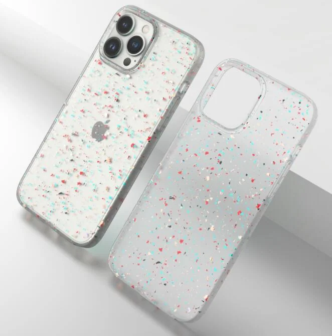 Two clear speckled recycled silicone phone cases, one on a white iPhone, angled on a light background