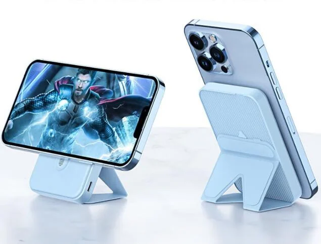 White Magsafe power bank with kickstand charging a smartphone in landscape and portrait modes.