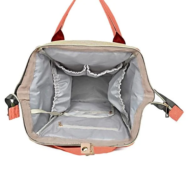 Bag hanging on a stroller with a baby seat and diaper bag attached