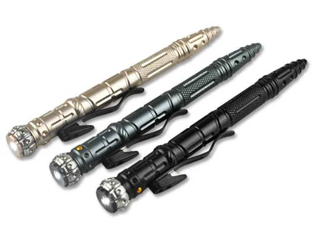 Three tactical multifunction ballpoint pens in gold, grey-green, and black, each with an LED light and pocket clip