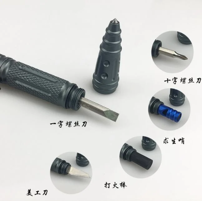 Pen held in hand with the whistle and rope cutter visible, demonstrating its compact size