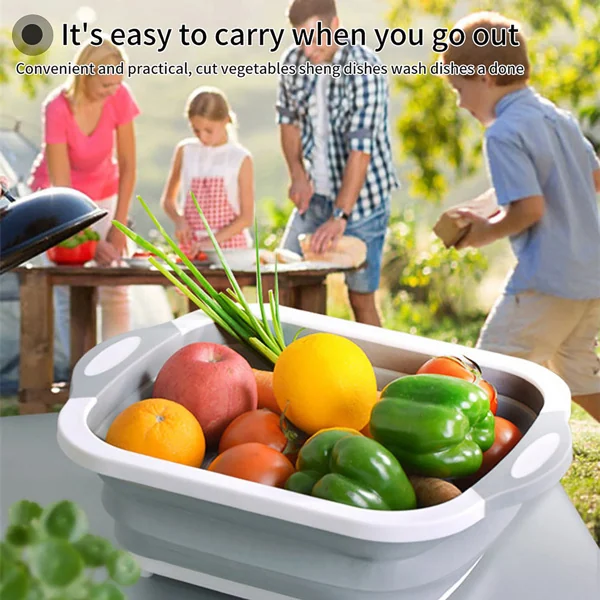 Basin unfolded and used as a chopping board with a knife cutting a vegetable