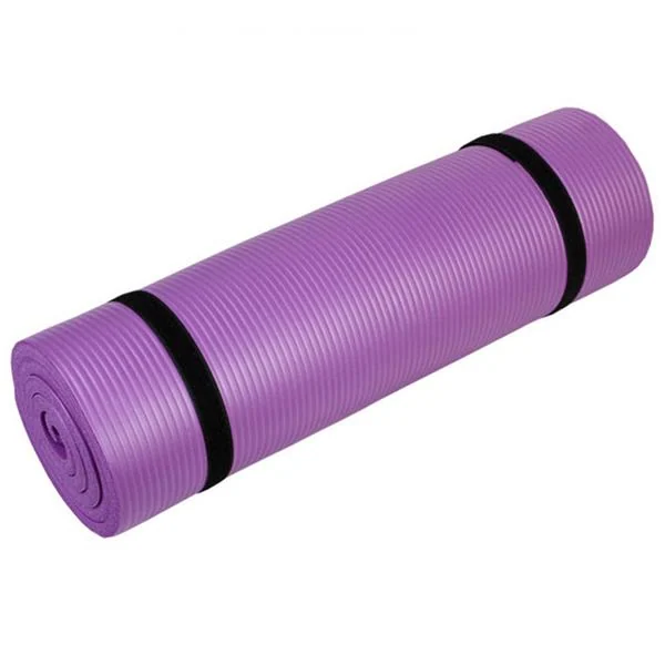Yoga mat placed on a tile floor with a person in a standing pose, showing grip