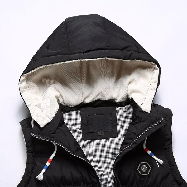 Black hooded padded vest close-up with cream hood lining, checkered interior, striped drawstrings, and size L tag.