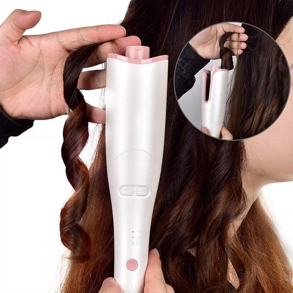 Close-up of the directional buttons and beep indicator on the curling iron handle