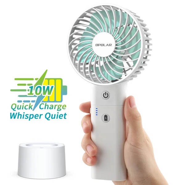 Hand holding white rechargeable handheld fan with power buttons and 10W quick charge graphic, detachable base beside it