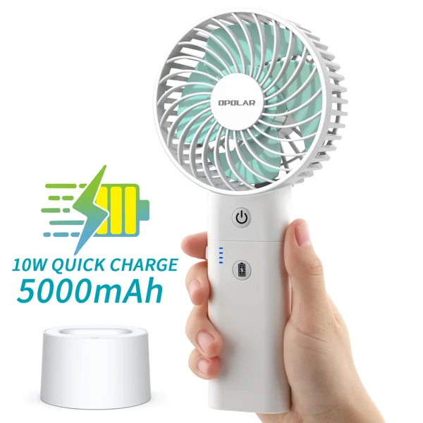 Fan placed on a table with the battery removed and charging via USB