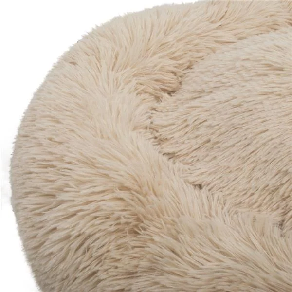 Side view of the round pet bed showing its soft, low-profile shape