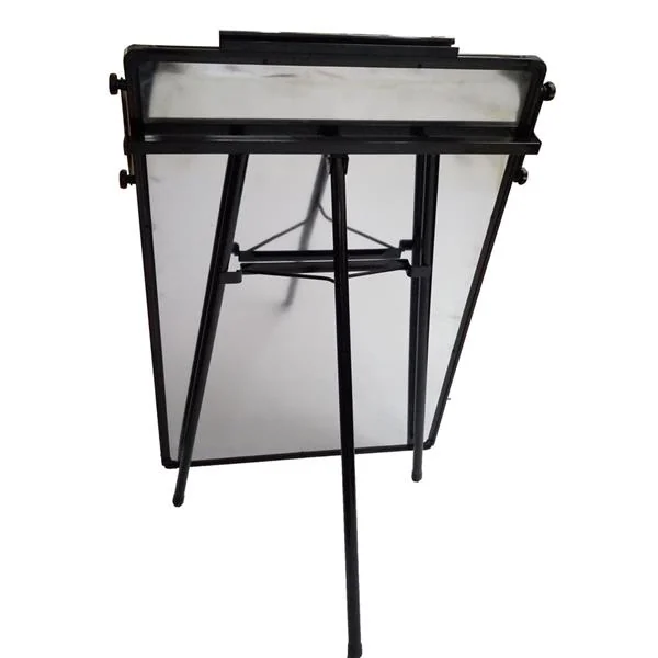 Rear view of a single-sided magnetic dry-erase whiteboard with black frame and tripod stand