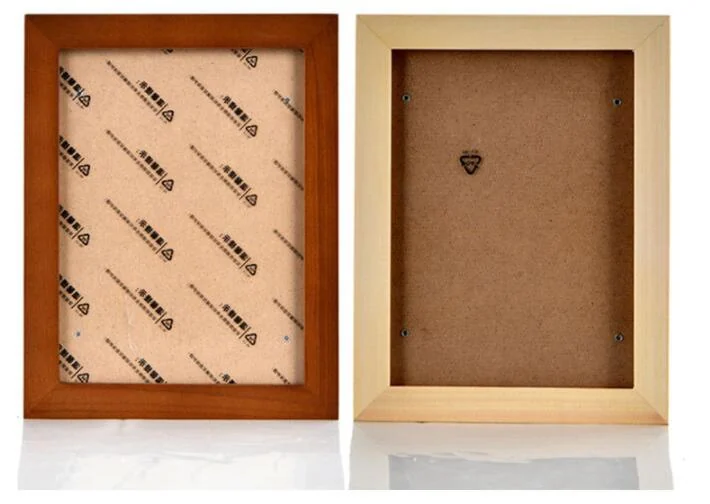 Two wooden photo frames shown from the back, one with printed kraft paper backing and one with MDF backing and metal hanging hook