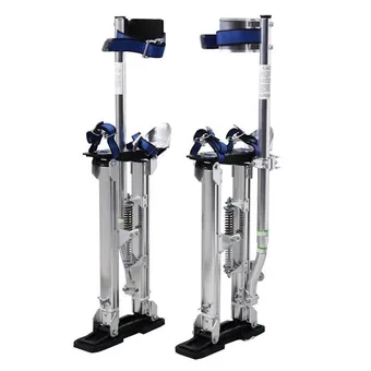 Pair of silver aluminum stilts with blue leg straps, coil springs and black rubber feet on a white background