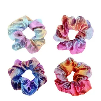 Four shiny holographic hair scrunchies in rainbow metallic colors arranged in a grid on a white background