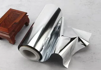 Roll of shiny silver metallized laminated film partially un