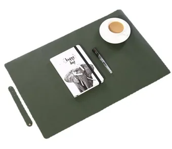 Dark green PU leather desk pad styled with a white coffee cup, pen and elephant notebook on a white background