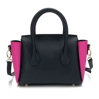 Mini black handbag with pink side panels, gold-tone hardware and dual top handles on a white background