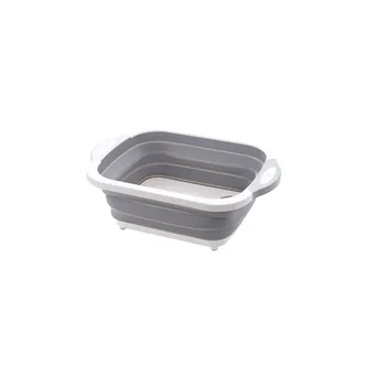 Grey collapsible silicone washing basin with white rim and oval-cutout handles, shown collapsed on a plain white background