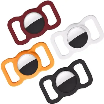 Four soft silicone AirTag holder cases with keychain loops in red, white, orange and black