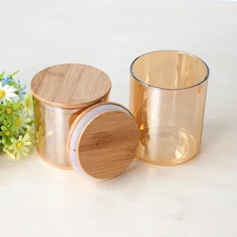 Two amber glass storage jars with round bamboo lids, one open showing a silicone seal ring, on a white surface with small flowers