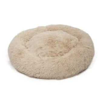 Round light beige plush calming pet bed for dogs and cats shown on a plain white background