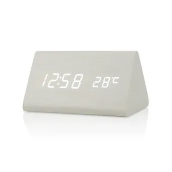 White triangular LED digital alarm clock showing 12:58 and 28 degrees Celsius on its display
