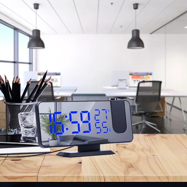 USB LED digital mirror alarm clock showing 16:59 on a wooden desk