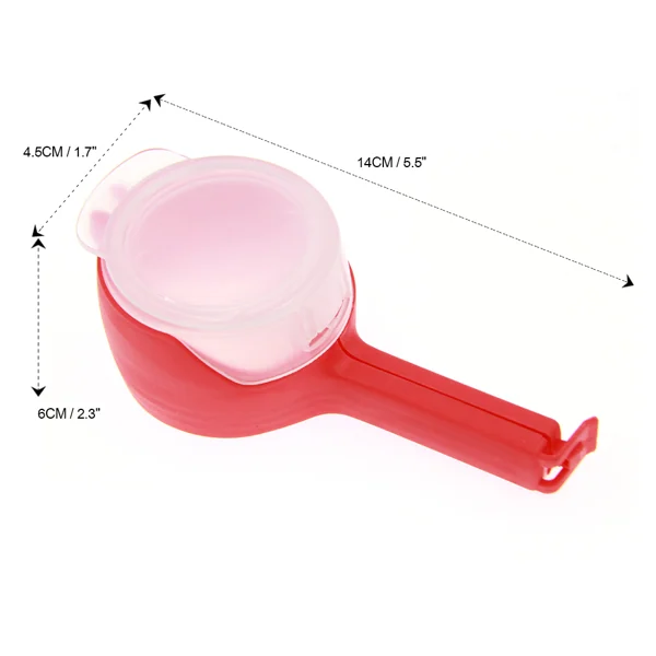 Sealing clip in use, hand holding the bag while pouring snacks