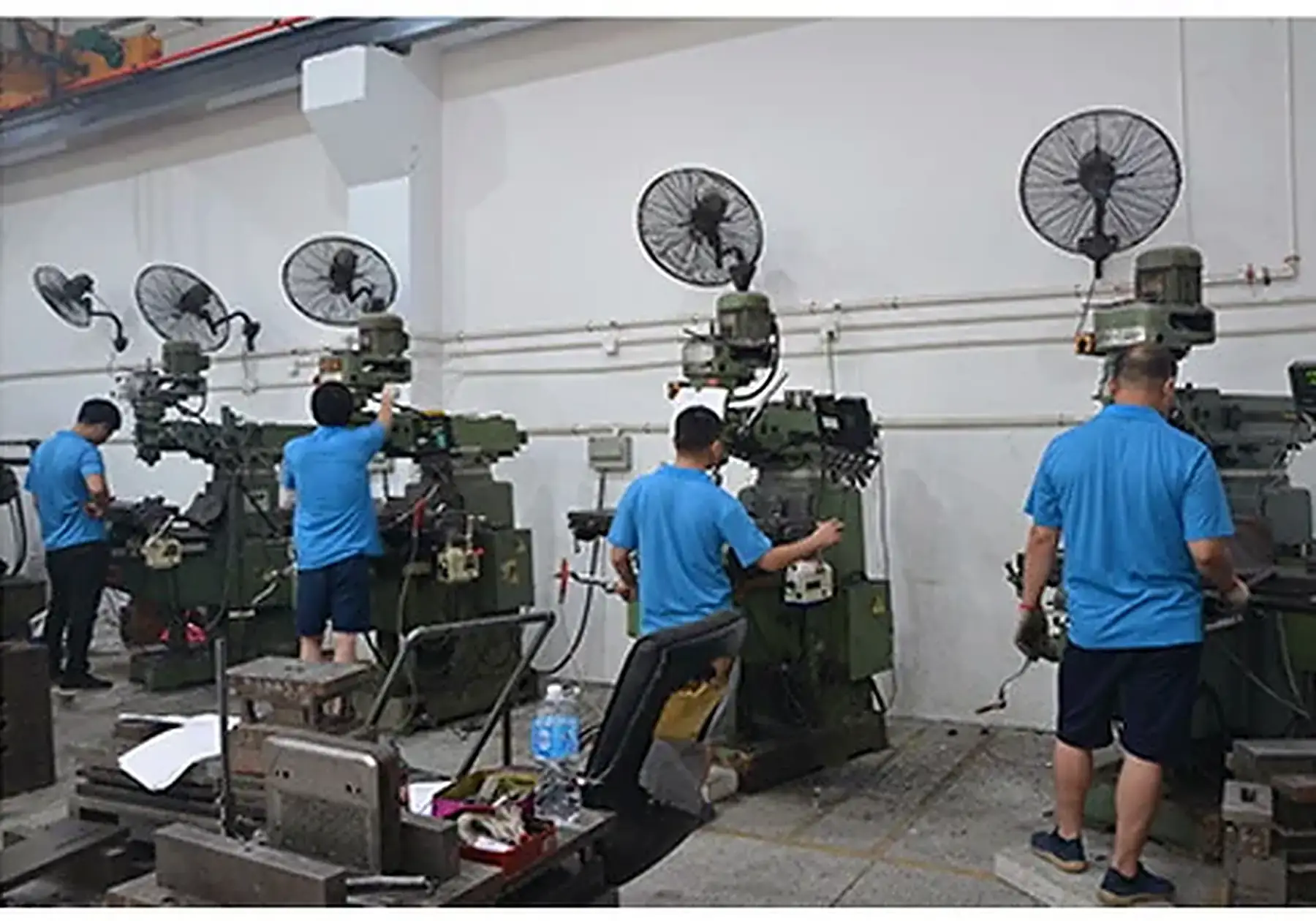 Tooling workshop with milling machines used to cut computer case dies at Ulike