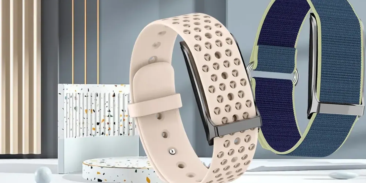 Unique screenless activity trackers with silicone and nylon woven straps on a studio display