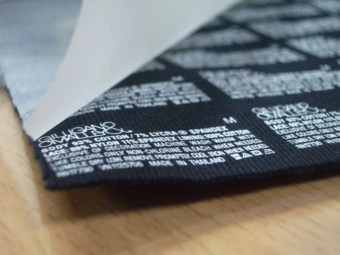 Laminated printed label sheets produced with hot melt adhesive