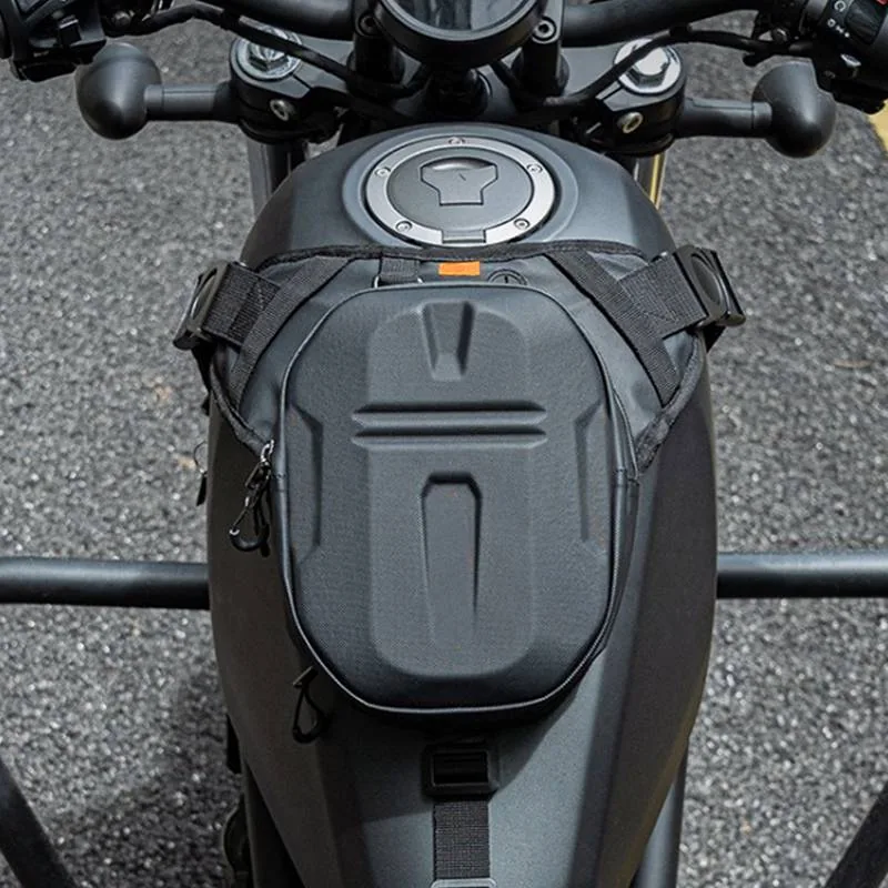 Hard shell motorcycle tank bag fitted to a motorcycle fuel tank