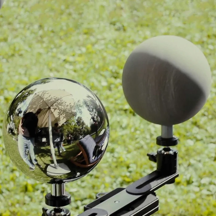 12.6cm chrome and grey VFX balls on a handle in a field