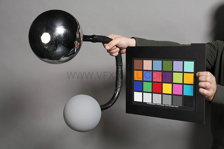 20cm chrome VFX ball held beside a colour checker chart