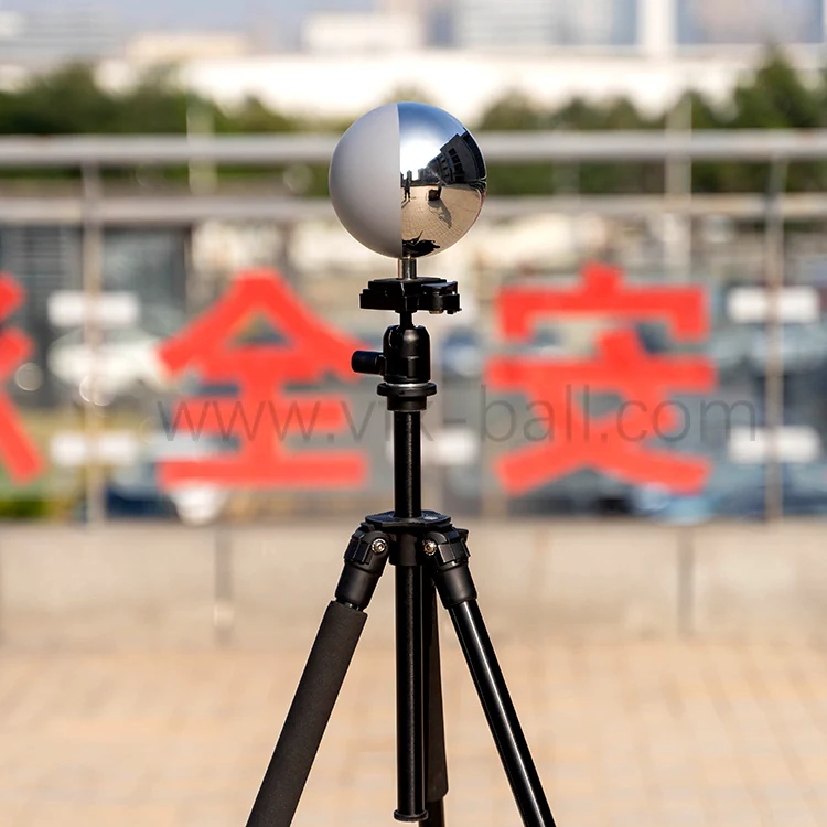 Chrome and grey VFX ball mounted on a tripod on location
