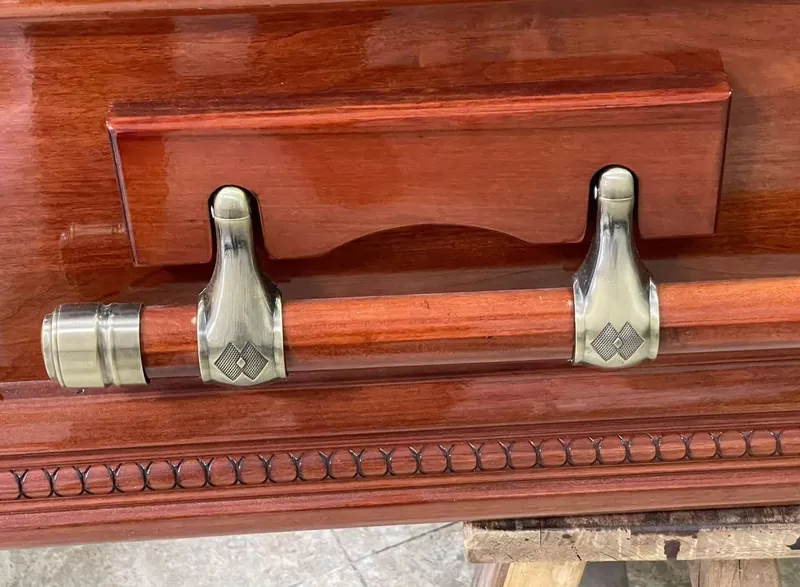 Coffin hardware fitted to a finished wooden coffin, supplied by Virtue Hardware Co., Ltd