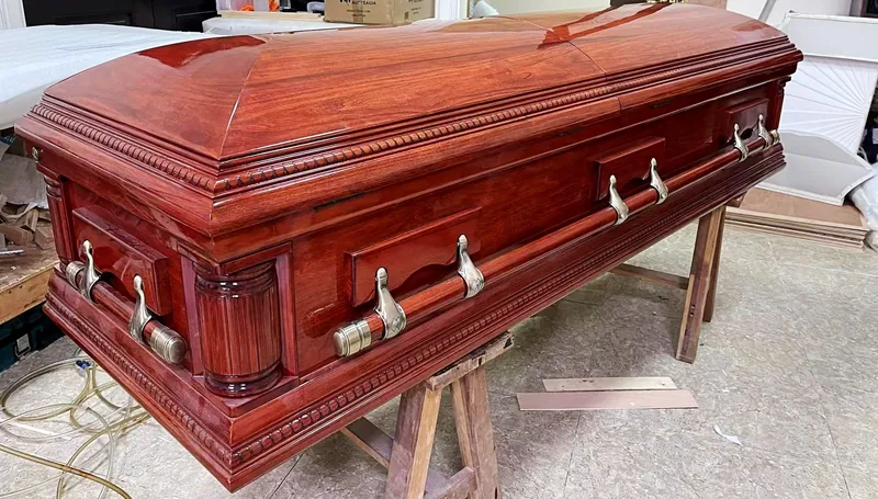 Coffin hardware fitted to a finished wooden coffin, supplied by Virtue Hardware Co., Ltd