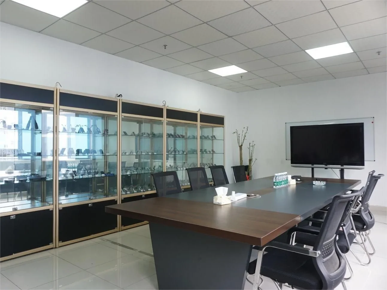 Gotrack meeting room with a display cabinet of GPS tracker samples