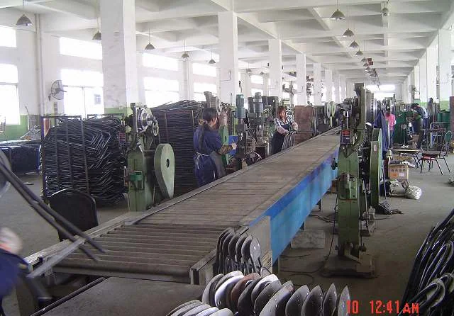 Assembly conveyor line with steel furniture components and press stations