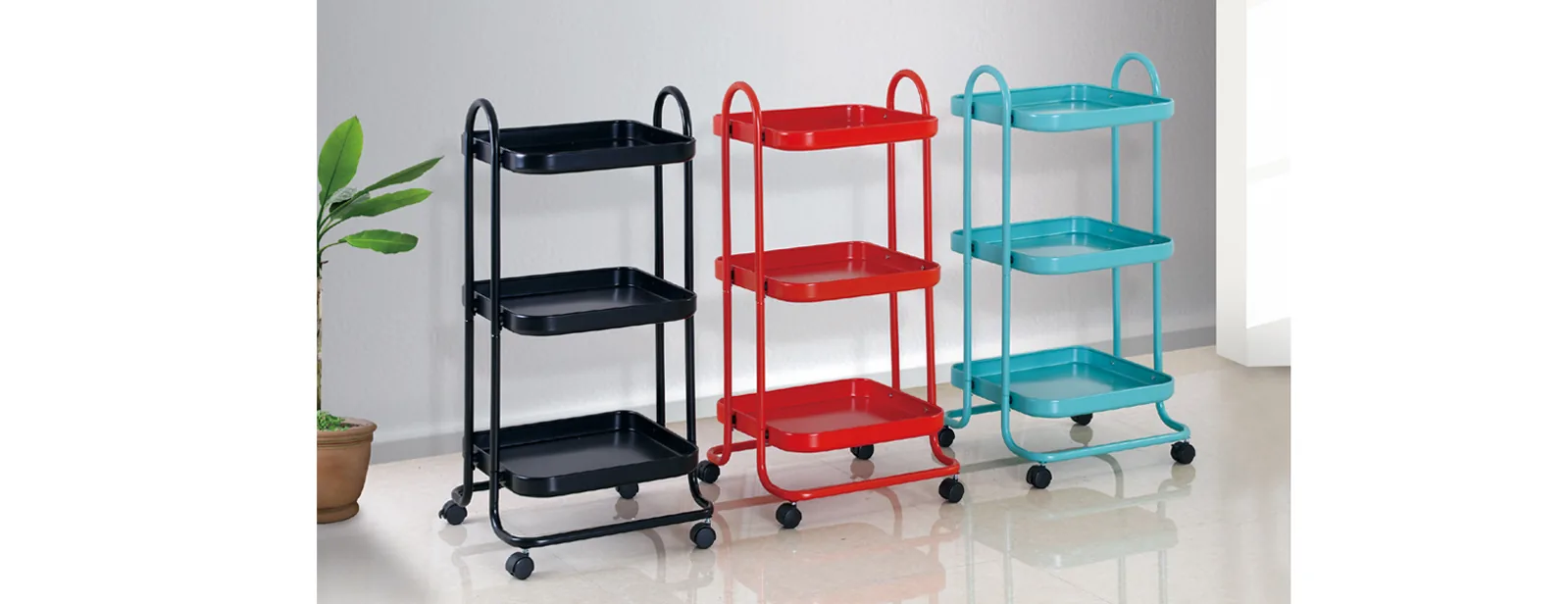 Three-tier steel kitchen trolleys in black red and turquoise on castors
