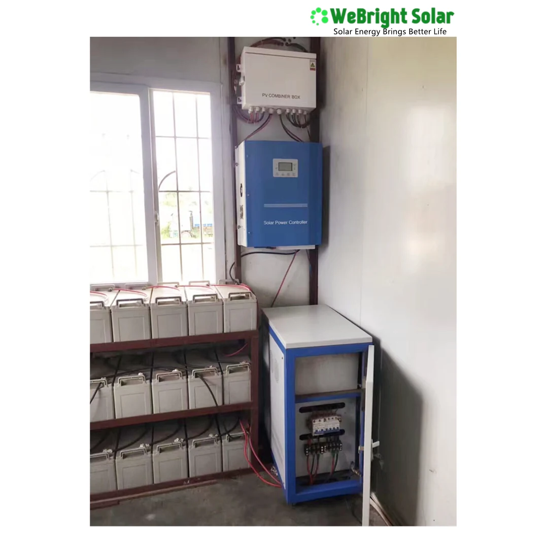 Wall-mounted blue solar inverter and white charge controller above a battery rack and breaker box.