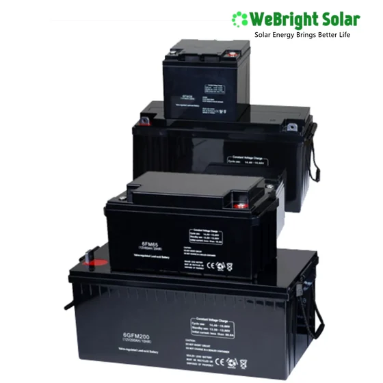 A stack of four black rectangular lead-acid batteries of varying sizes on a white background.